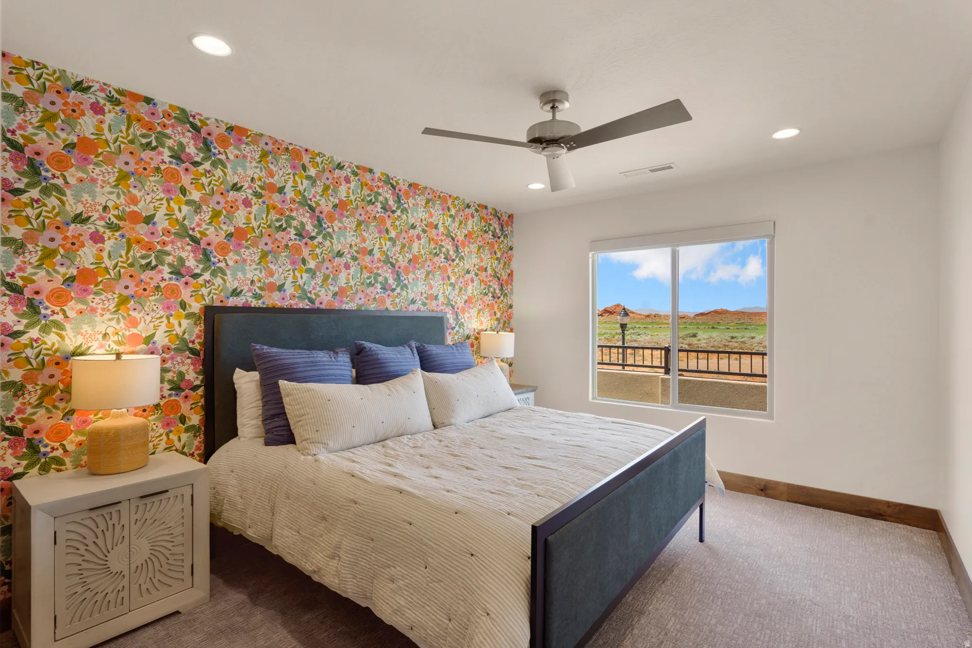Accent wall with floral wallpaper, recessed lighting, ceiling fan, and carpet flooring