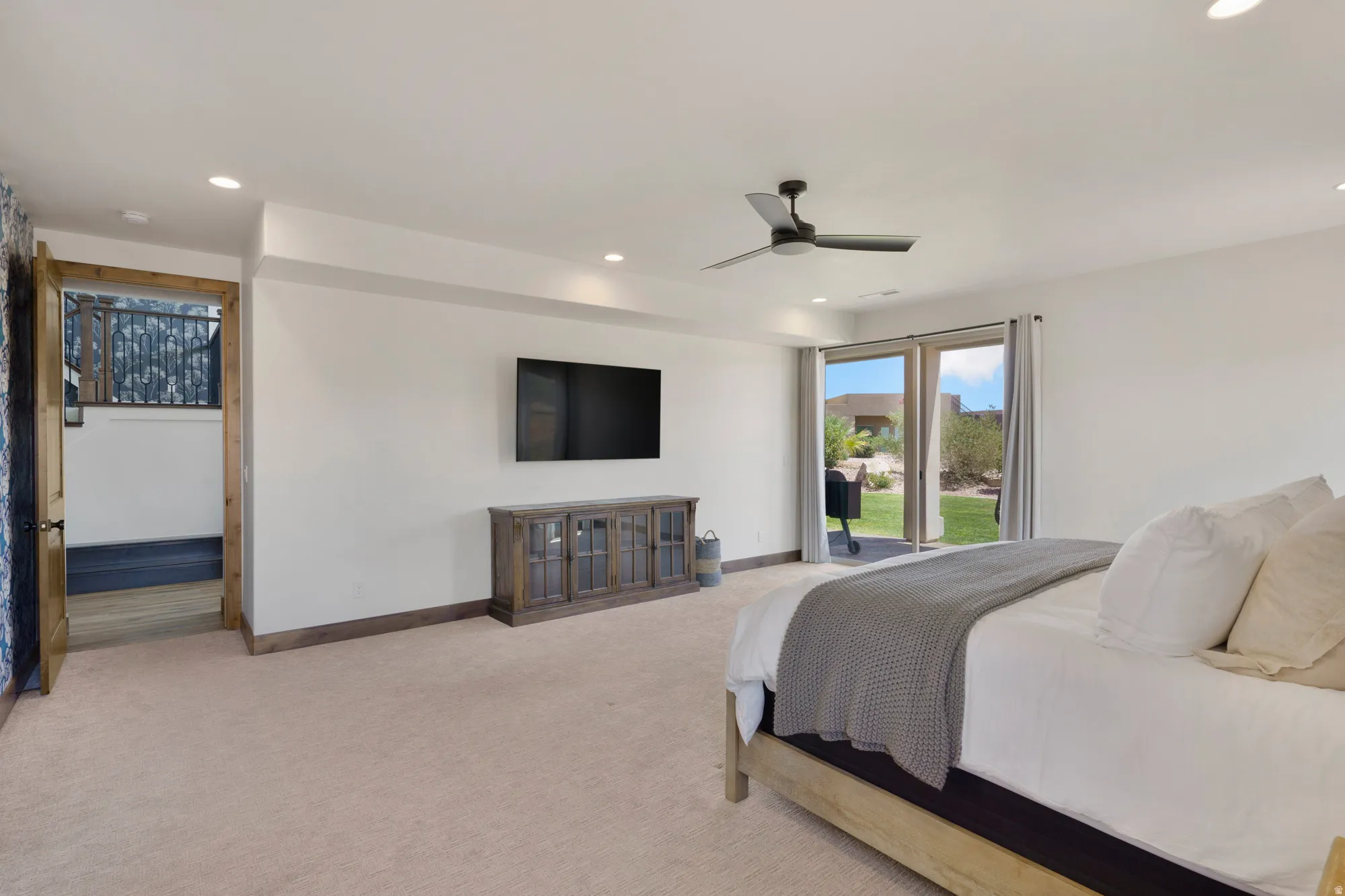 Recessed lighting, ceiling fan, and carpeted flooring