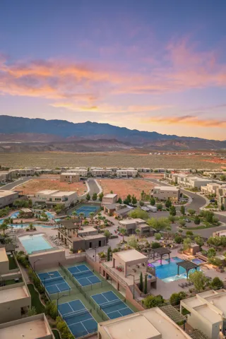 Community amenities including multiple swimming pools, pickleball courts, and a mountain backdrop