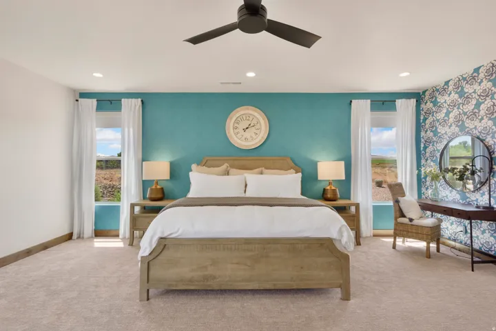 Recessed ceiling lighting, a ceiling fan, and carpeted flooring