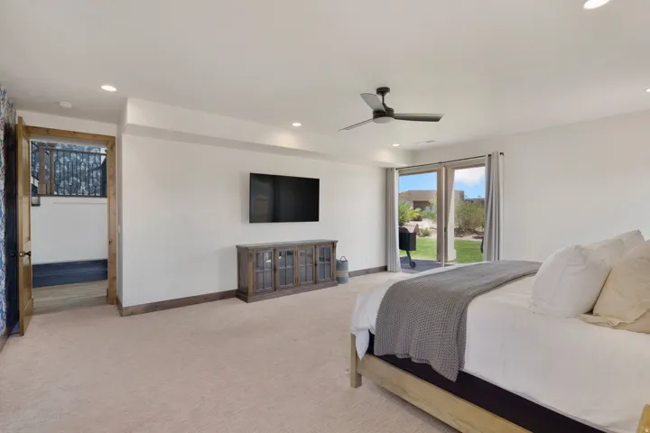 Recessed lighting, ceiling fan, and carpeted flooring