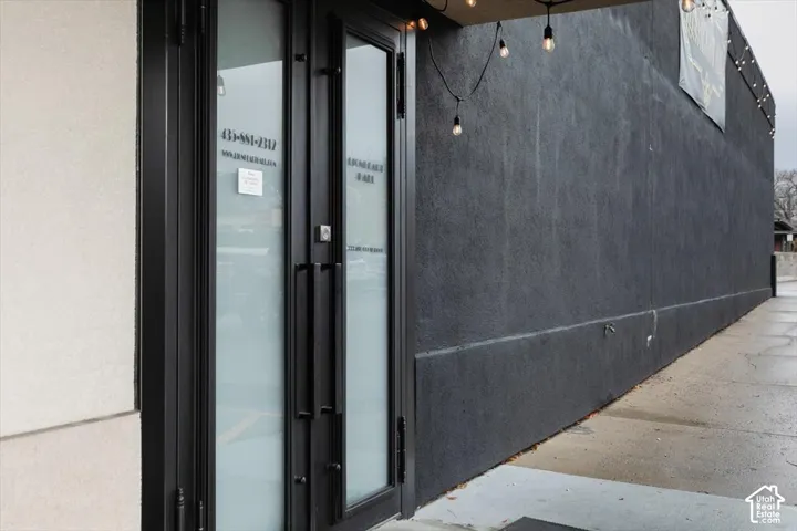 Frosted glass double doors with black framing and hardware