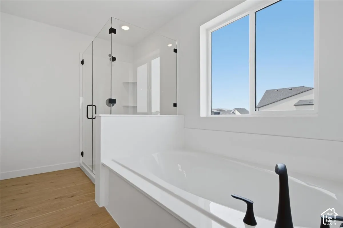 Large shower with a full euro shower enclosure.  Relax in the oversized 6' Tub.