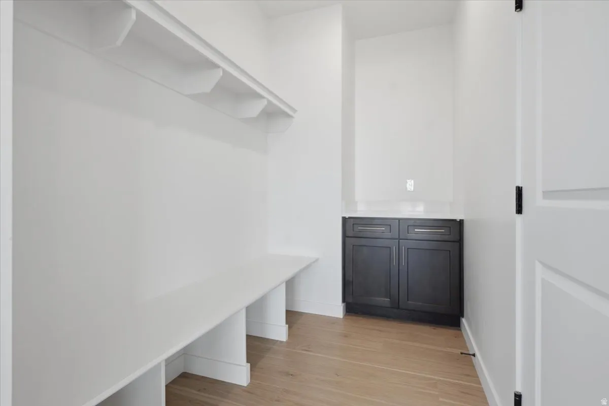 Huge mudroom for optimal organization.  Includes a cabinet with quartz countertops.