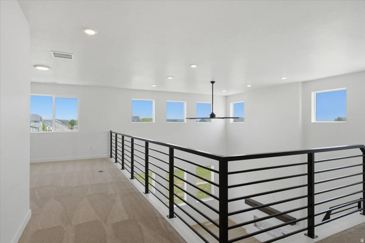 Open to below with modern railing.
