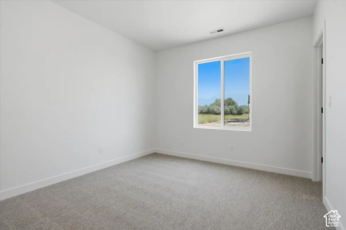 ADU Bedroom with walk in closet.  Ground Level Window.
