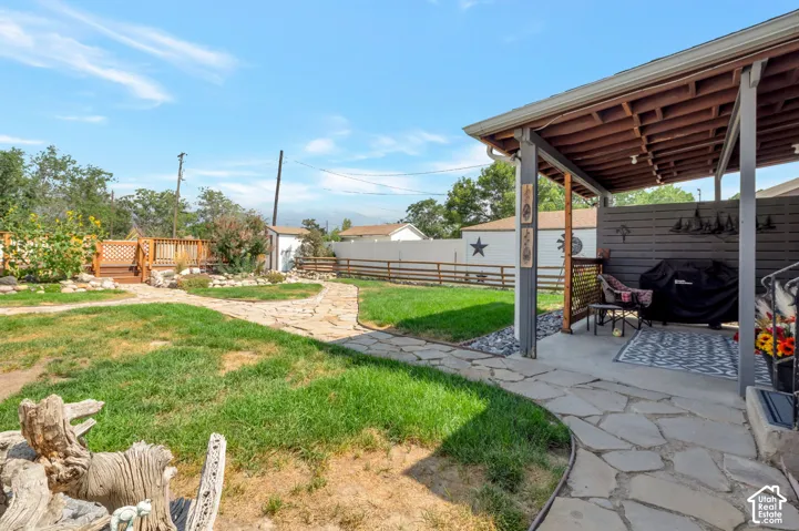 Covered patio featuring a solid roof and concrete flooring