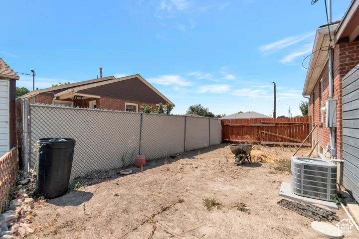 Newer 2 years old.Central air conditioning. Chain link fencing, wood privacy fencing, exterior brick siding, exterior wood siding, air conditioning unit