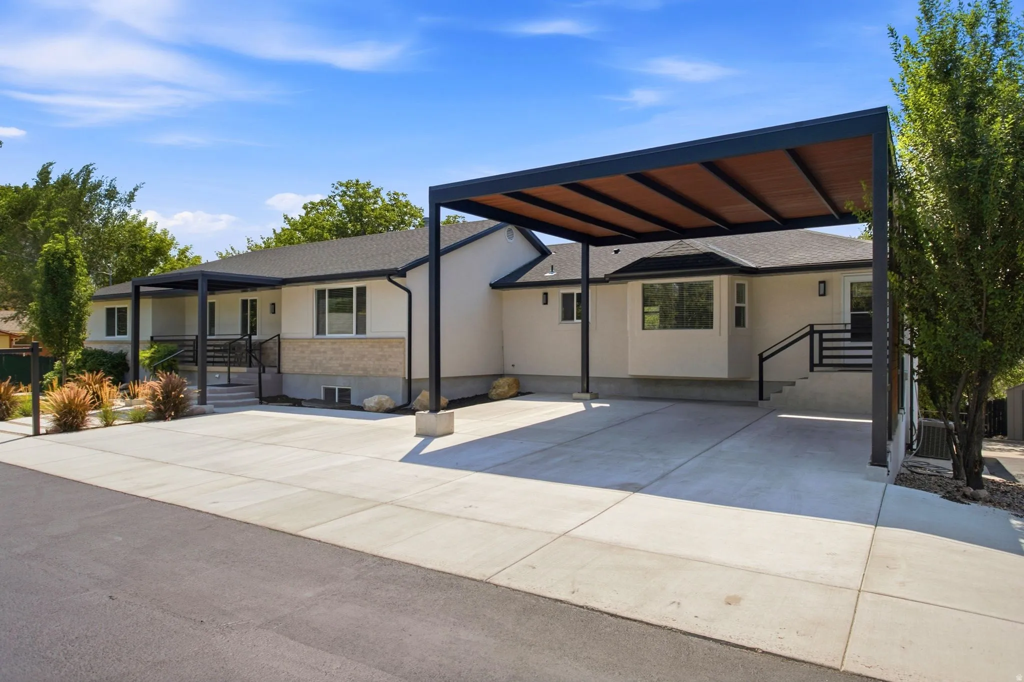 Stucco and stone exterior with multiple covered patios