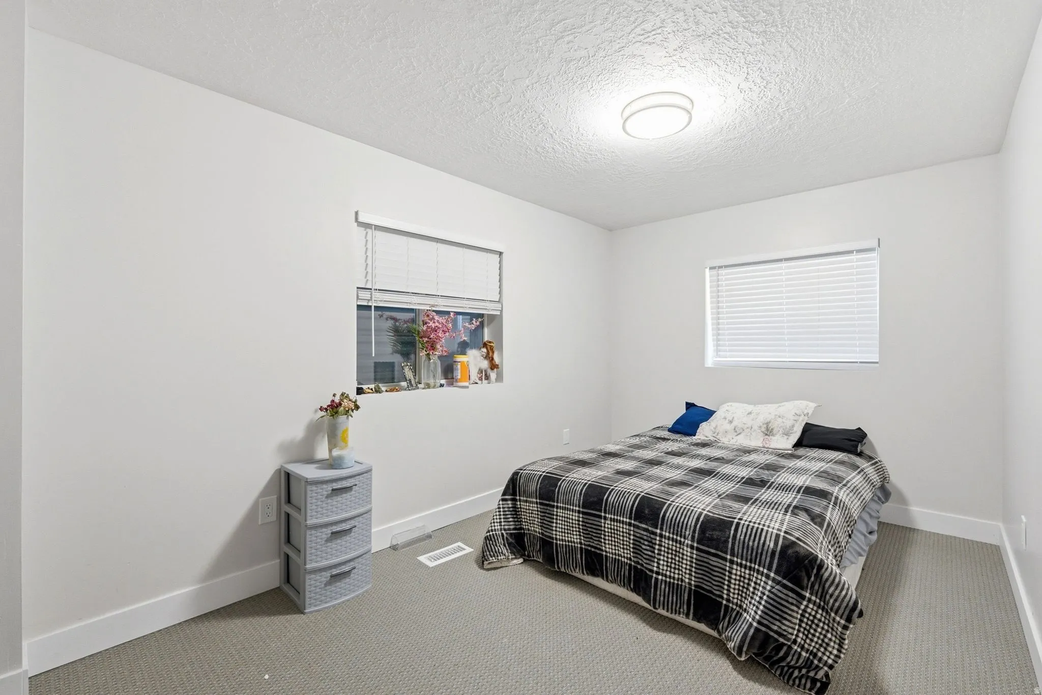 Gray carpeting provides a neutral foundation