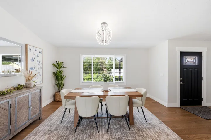 Wood-finish flooring throughout, complemented by a decorative overhead light fixture