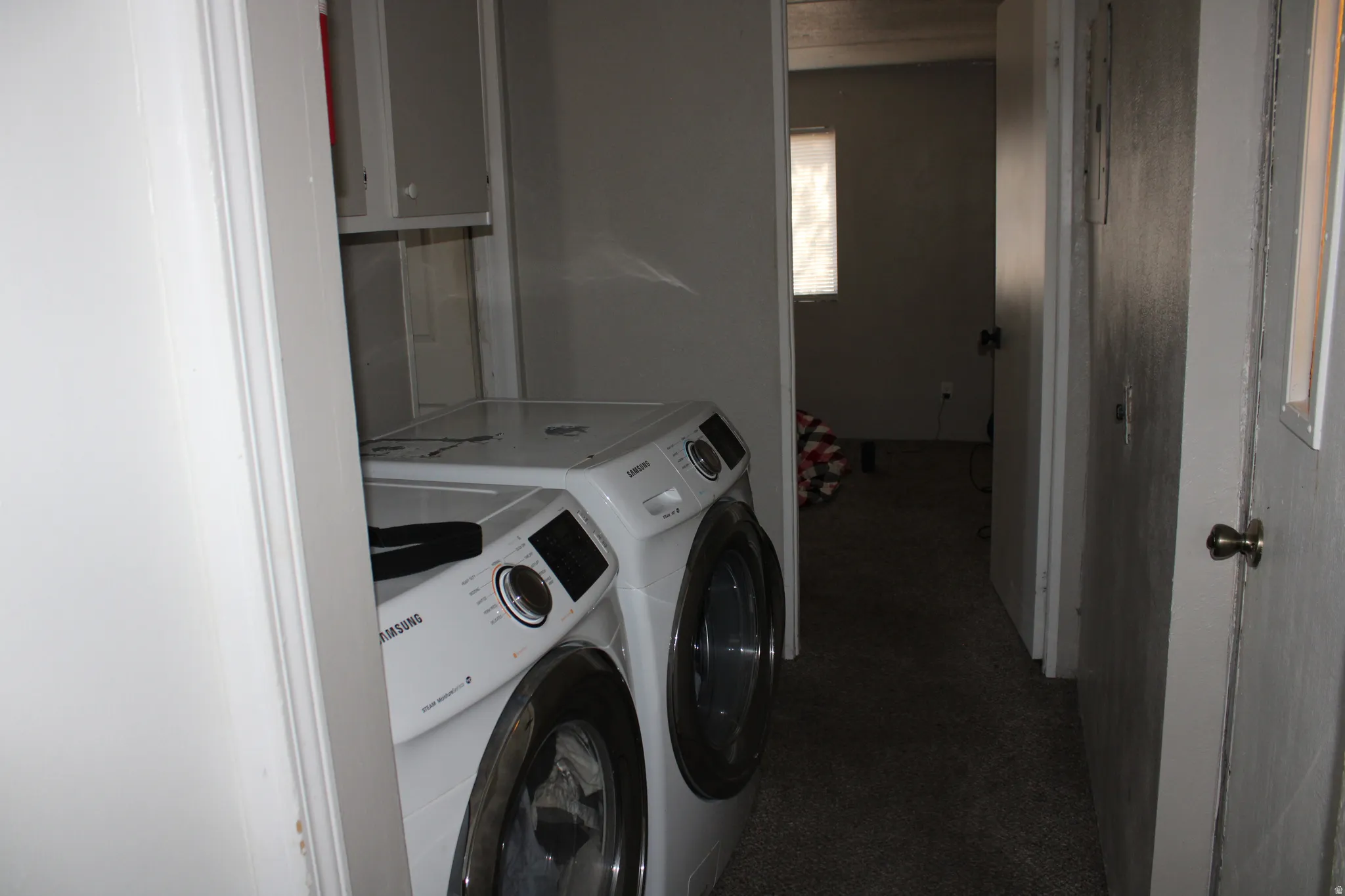 Laundry area with built-in shelving