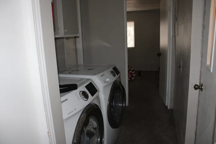 Laundry area with built-in shelving