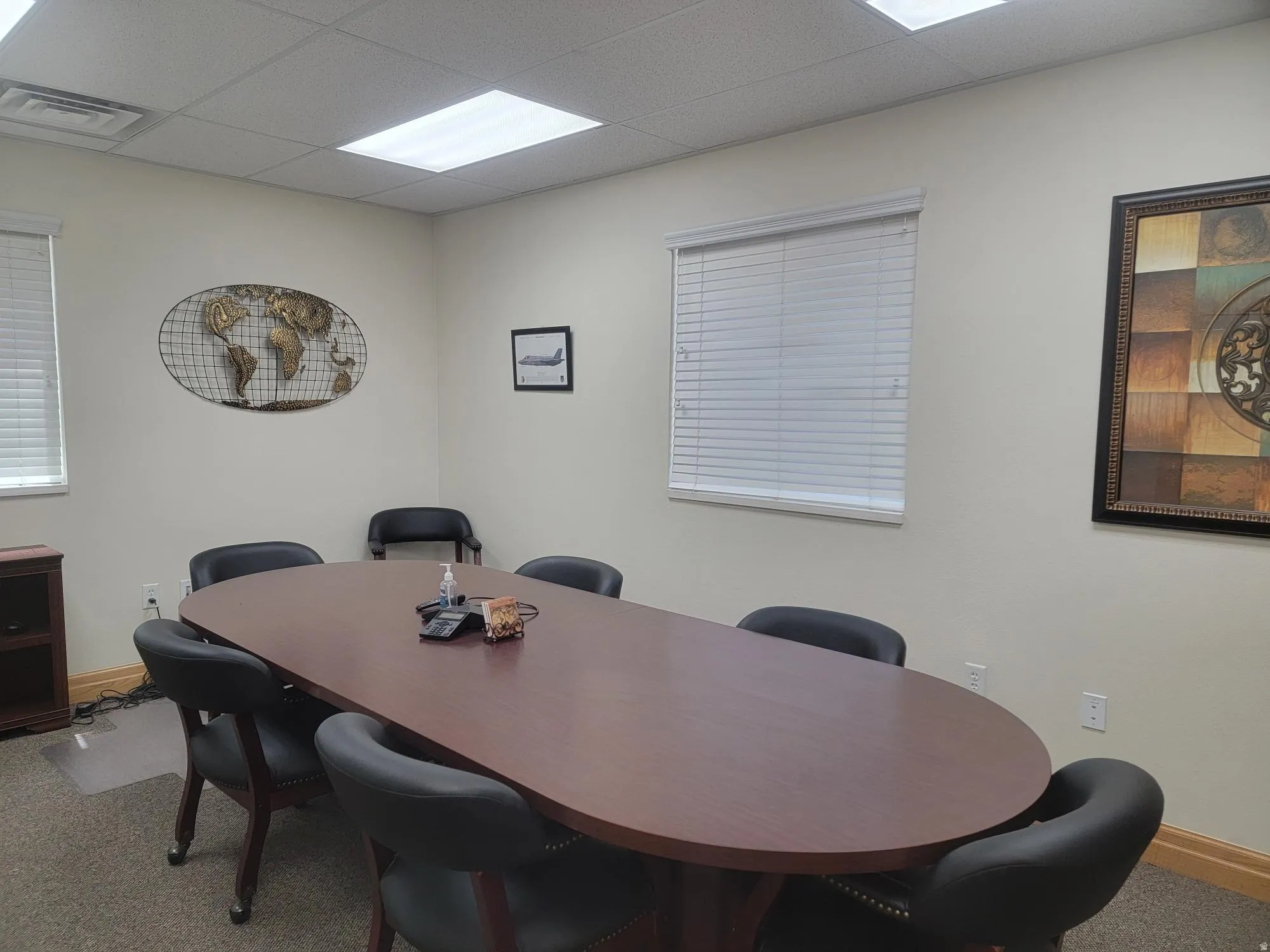 Spacious Conference/Meeting Room near Entrance. carpeted flooring, and blinds