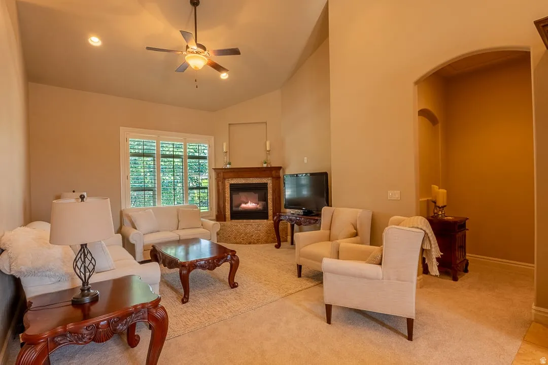 Vaulted ceiling with recessed lighting and ceiling fan