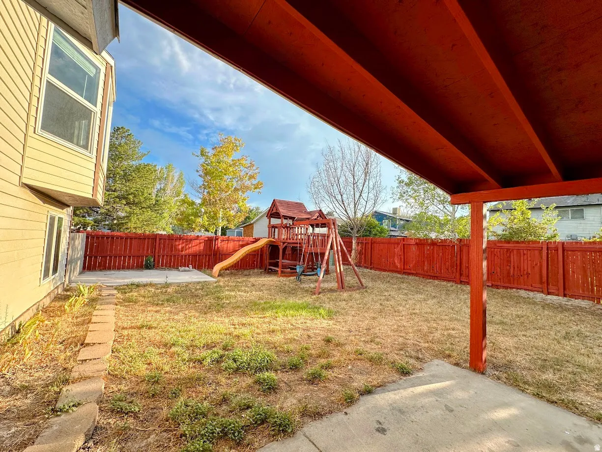 Covered patio area with concrete slab