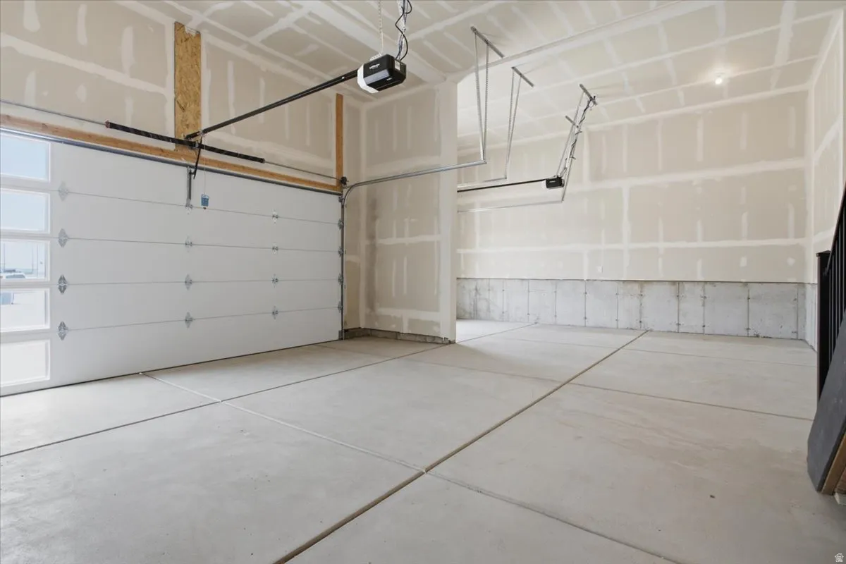 Large 3 Car Garage with Upgraded Garage Doors w/ Stacked Windows.