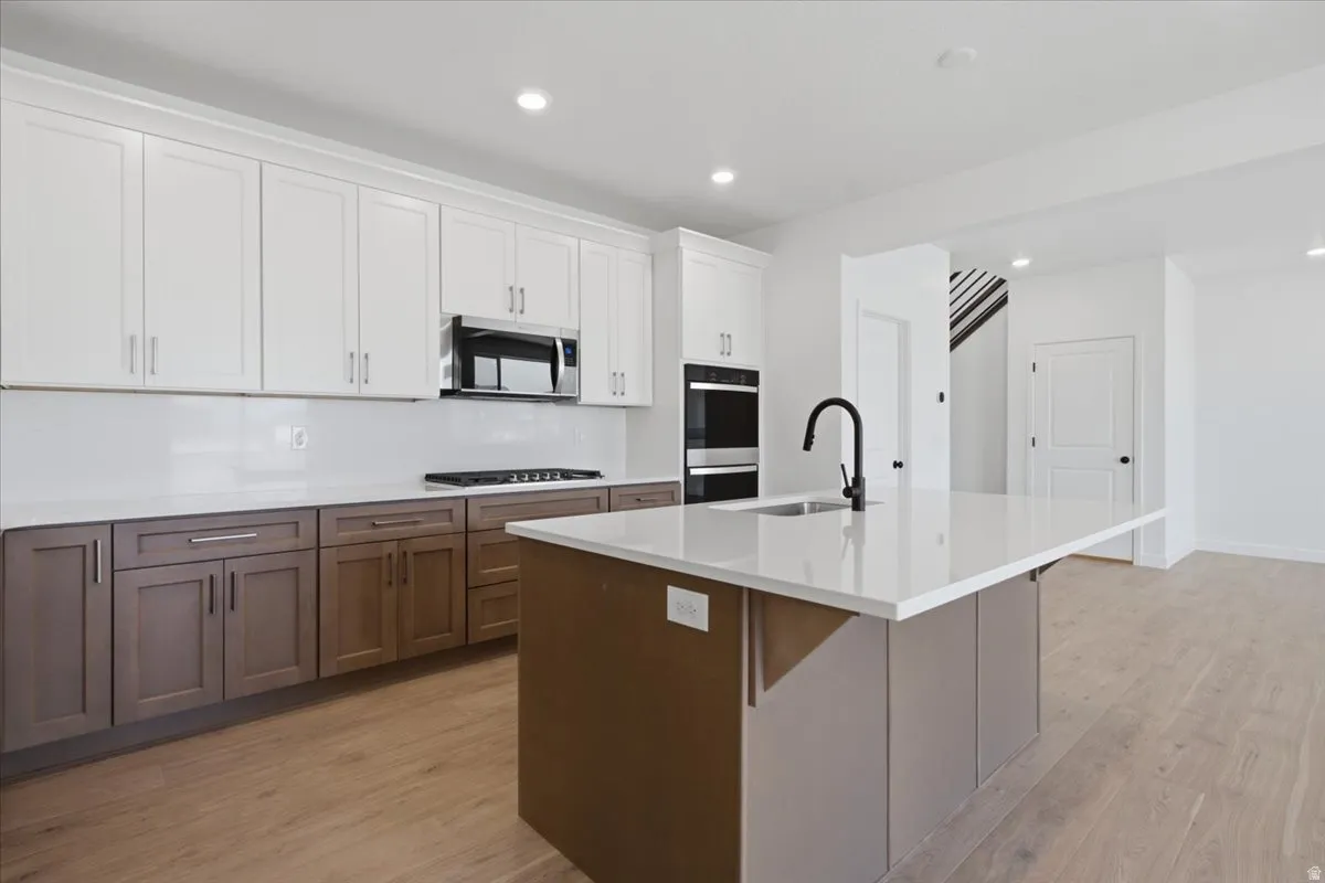 Double Ovens and 5 Burner Gas Cooktop