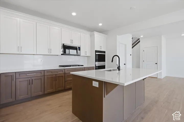 Double Ovens and 5 Burner Gas Cooktop