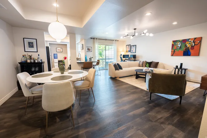 Wood-finish flooring throughout, recessed lighting, and a modern chandelier