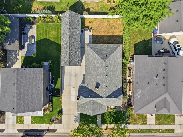 Expansive property featuring multiple single-story and two-story structures, mature trees, and well-maintained lawns