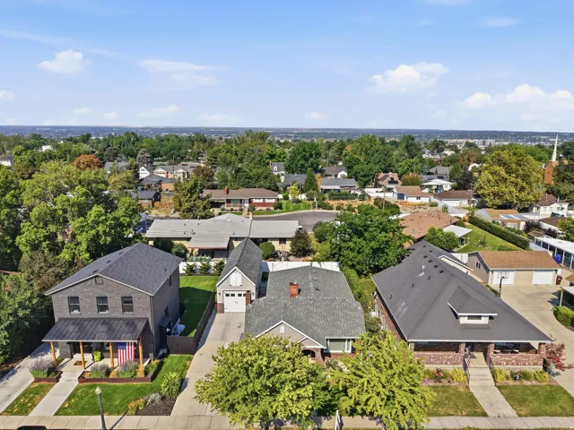 Residential street with established trees and surrounding properties
