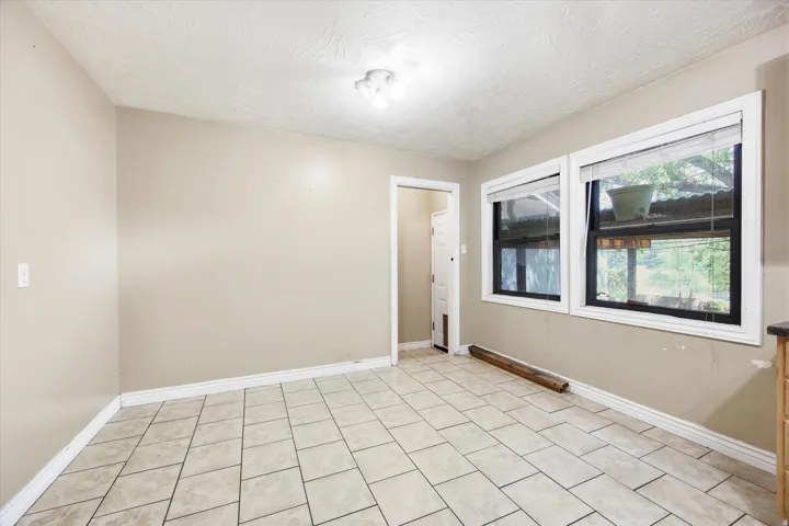 Tiled flooring paired with neutral wall tones