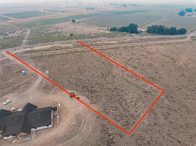 Expansive undeveloped land parcel with marked boundaries. Boundaries are an estimate.