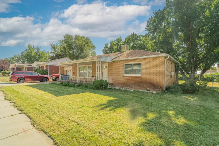 Charming brick ranch home situated on a generous lot with mature landscaping and established shade trees