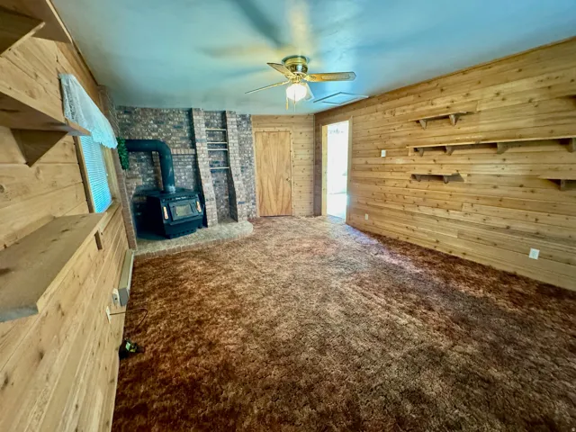 Wood-paneled walls with integrated shelving