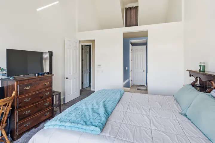Vaulted ceilings with an overhead linear light fixture