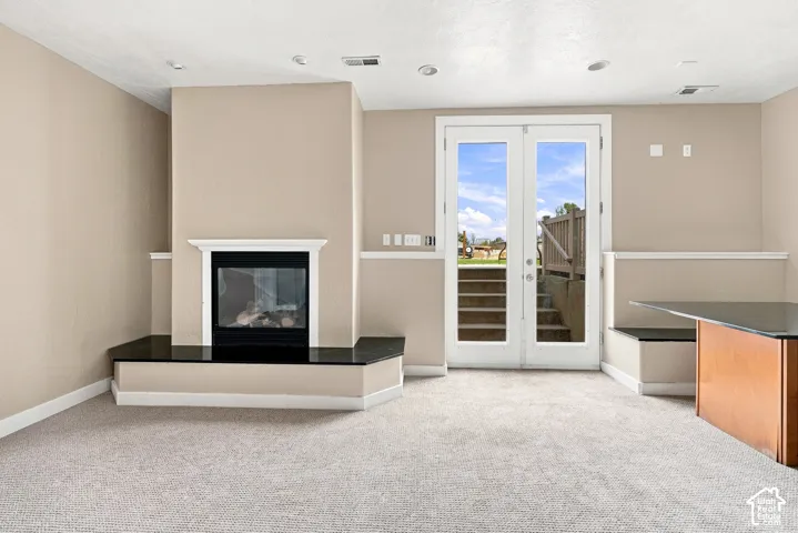 Built-in fireplace with a black surround and dark stone hearth