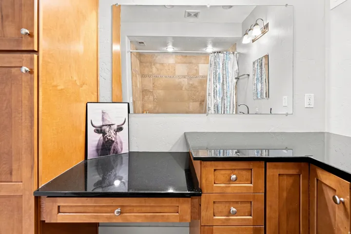 Custom cabinetry with a black countertop