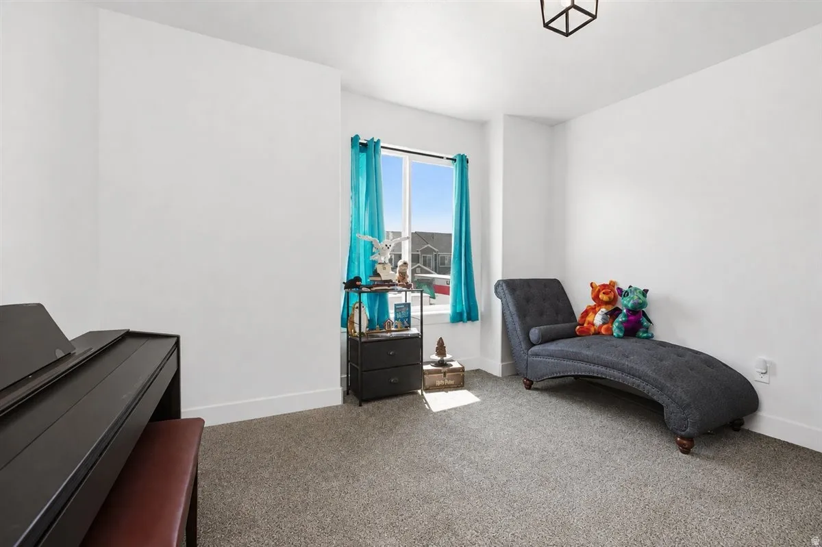 White painted walls with gray carpet flooring