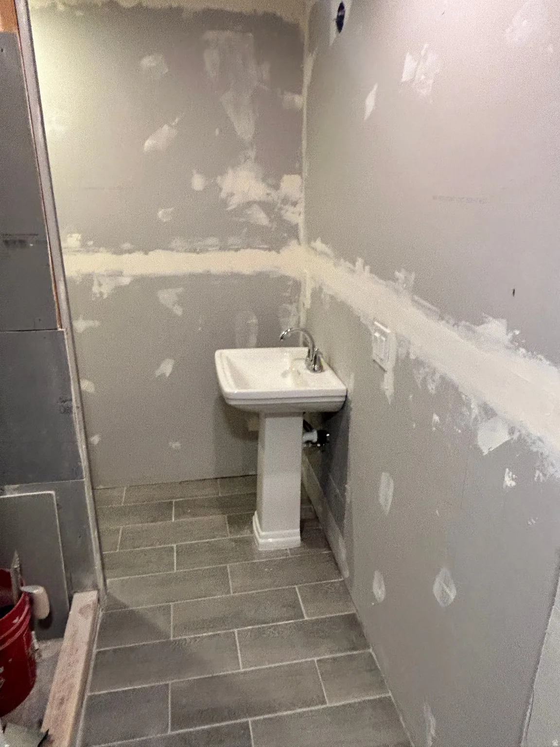 Pedestal sink with chrome-finish faucet