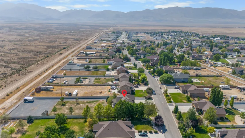 Residential development with established homes, paved streets, and mature trees