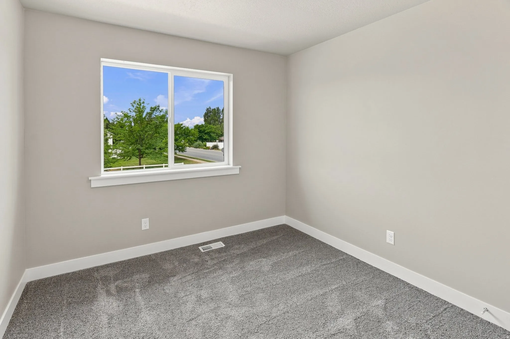 Neutral tone wall finish with white trim
