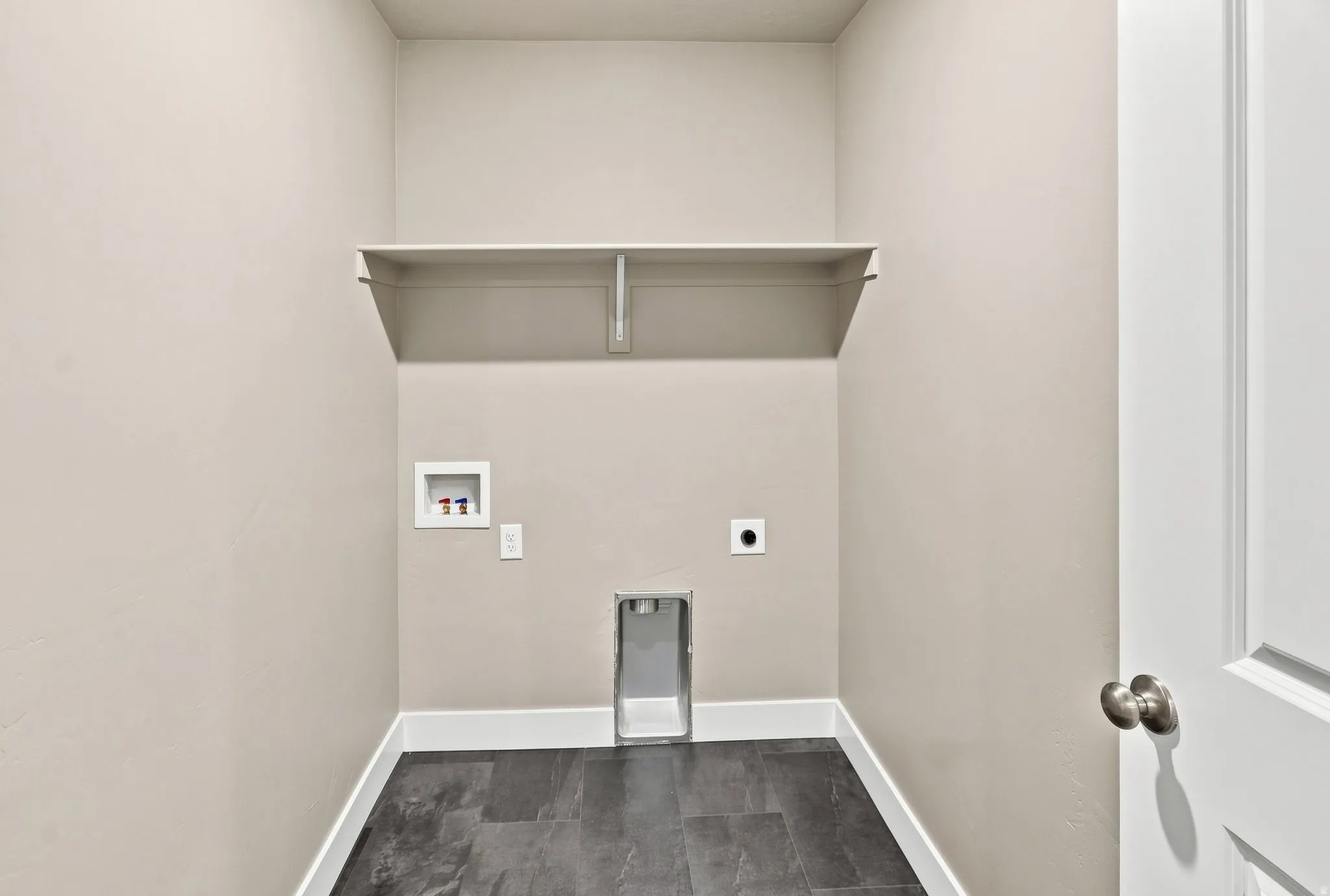 Built-in shelving unit, dark-toned flooring, and neutral wall paint