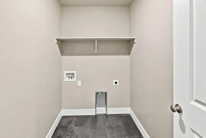 Built-in shelving unit, dark-toned flooring, and neutral wall paint