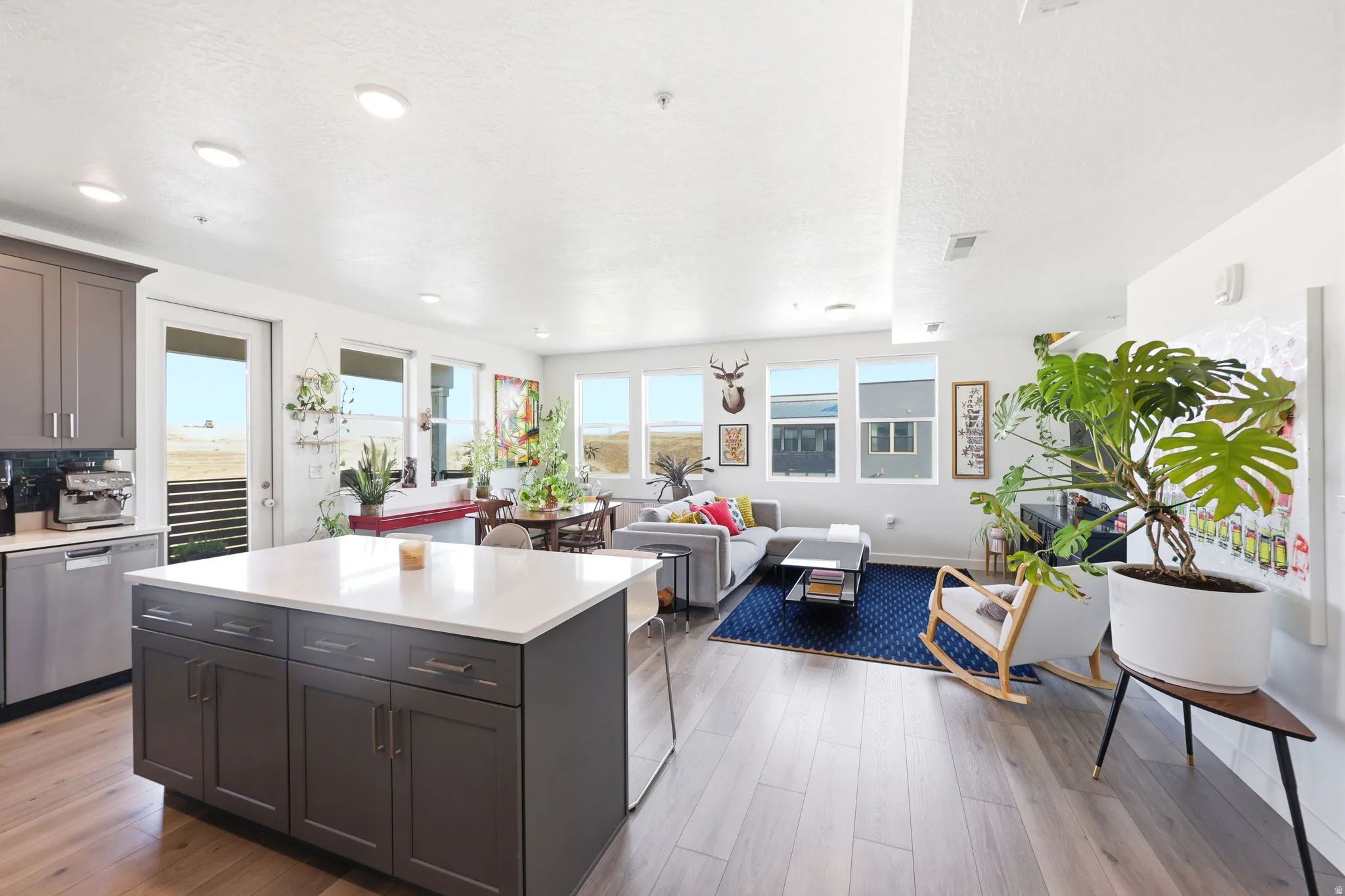 Open-concept living area with wood-finish flooring