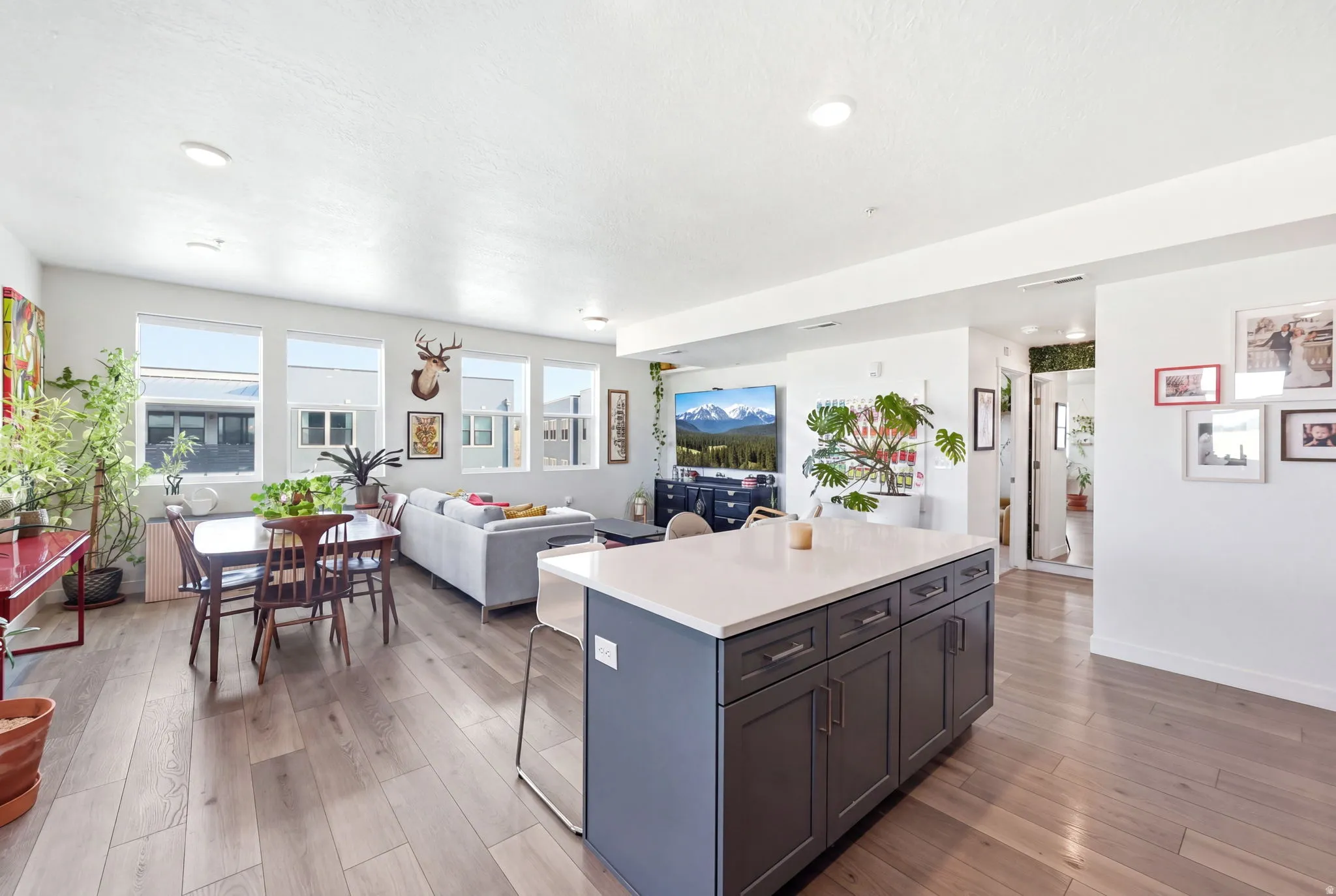 Open concept living space featuring wood-finish flooring