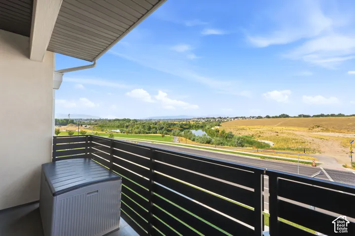 Balcony with slatted railing, providing a broad outdoor landscape