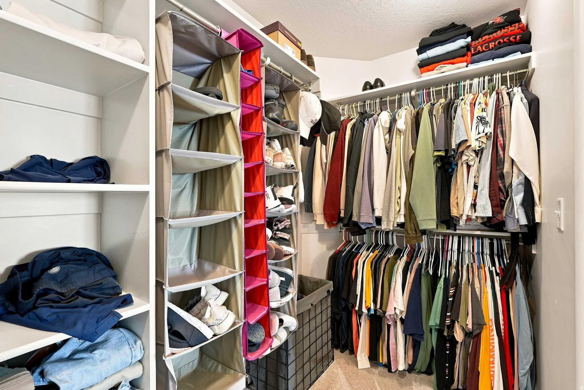 Built-in shelving, multiple hanging rods, and corner storage maximize organization