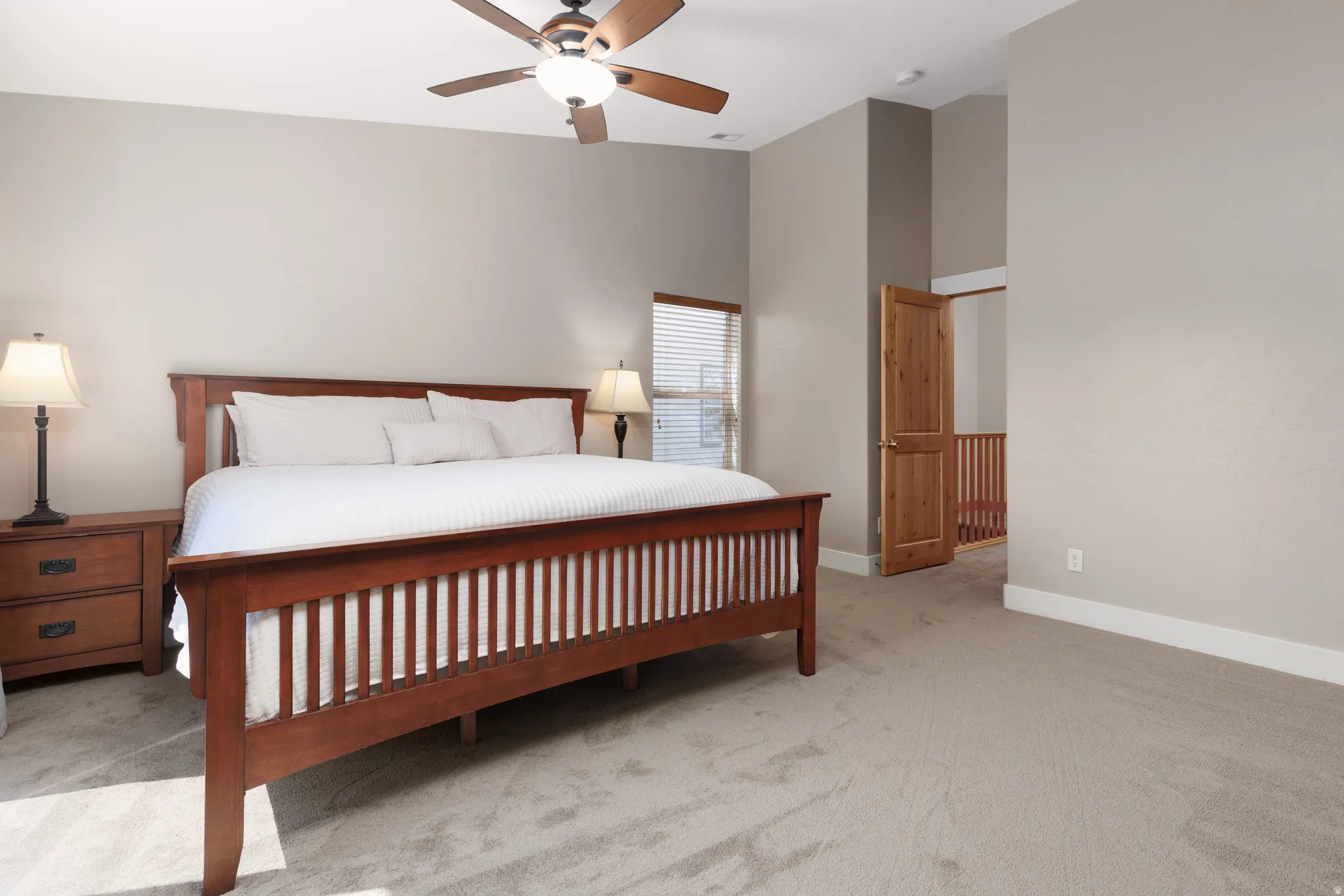 Tall vaulted ceiling and neutral wall tones