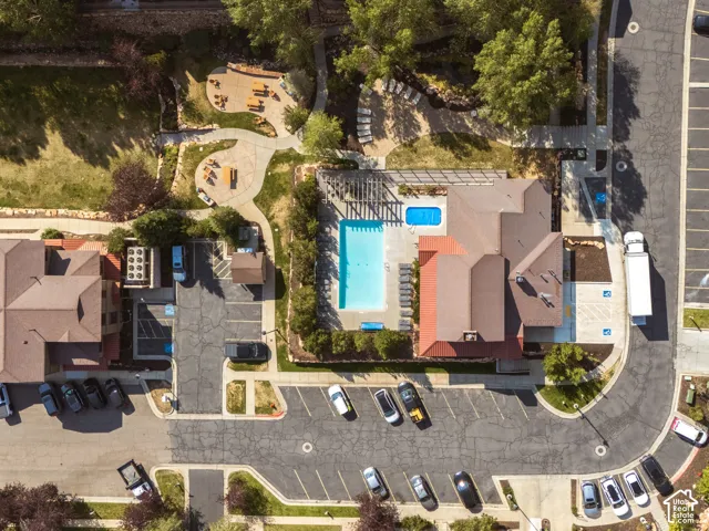 Clubhouse with fitness center, outdoor swimming pool, hot tub, BBQ, Fire Pit, and landscaped grounds with walking paths.