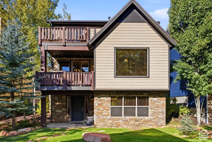 Multi-level residence featuring stone and siding exterior