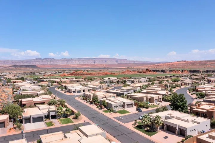 Residential development with desert landscaping and mountain scenery