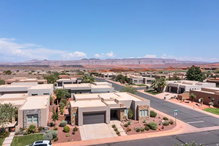 Contemporary residential neighborhood featuring desert landscaping and mountain scenery