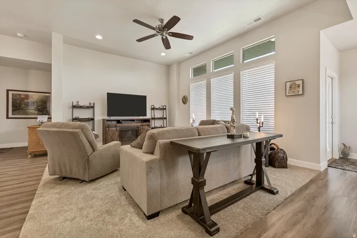 Recessed lighting, ceiling fan, and high windows provide ample illumination