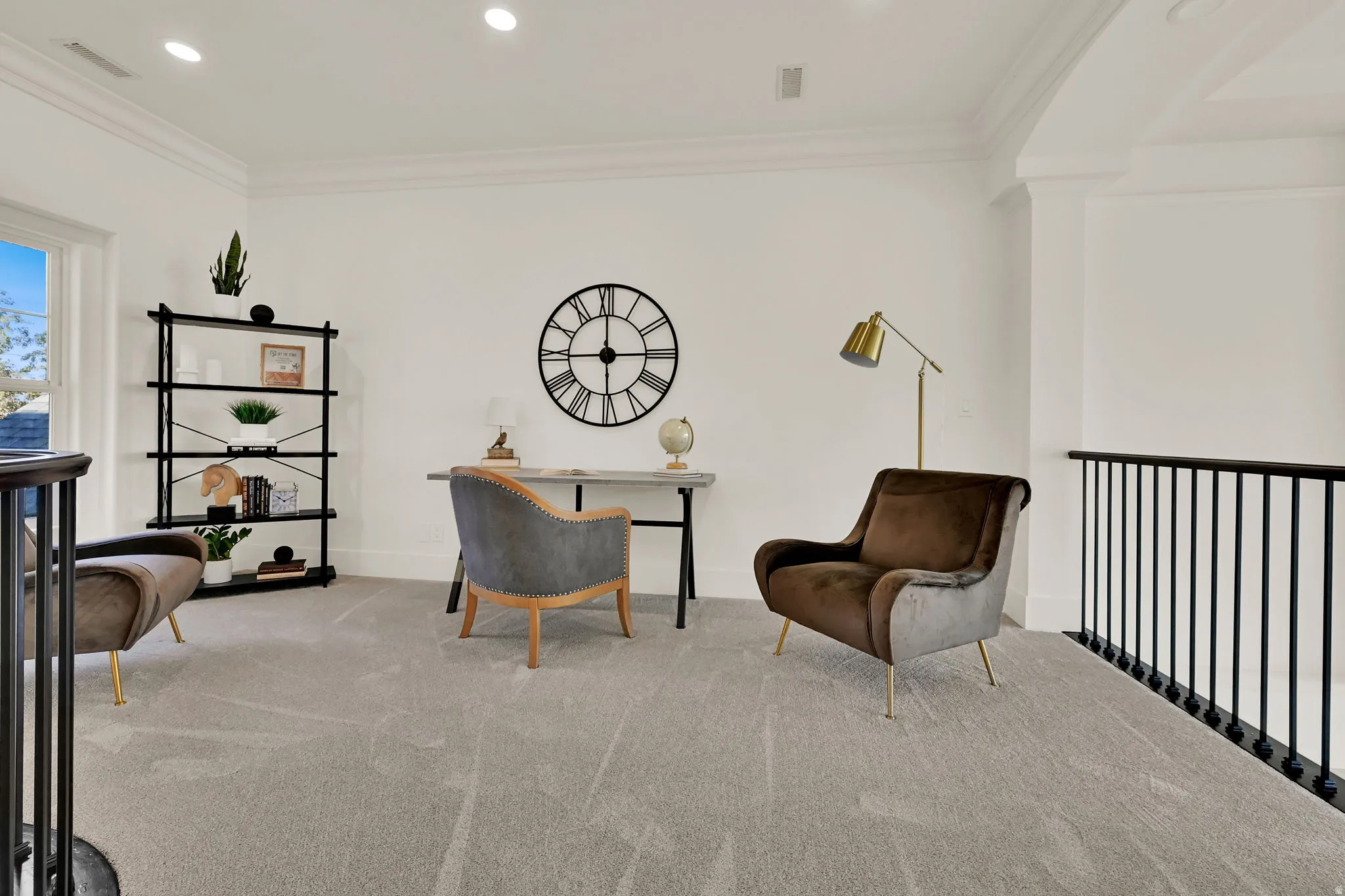 Loft area featuring light-toned carpeting, white walls, recessed lighting, crown molding, and black metal railings